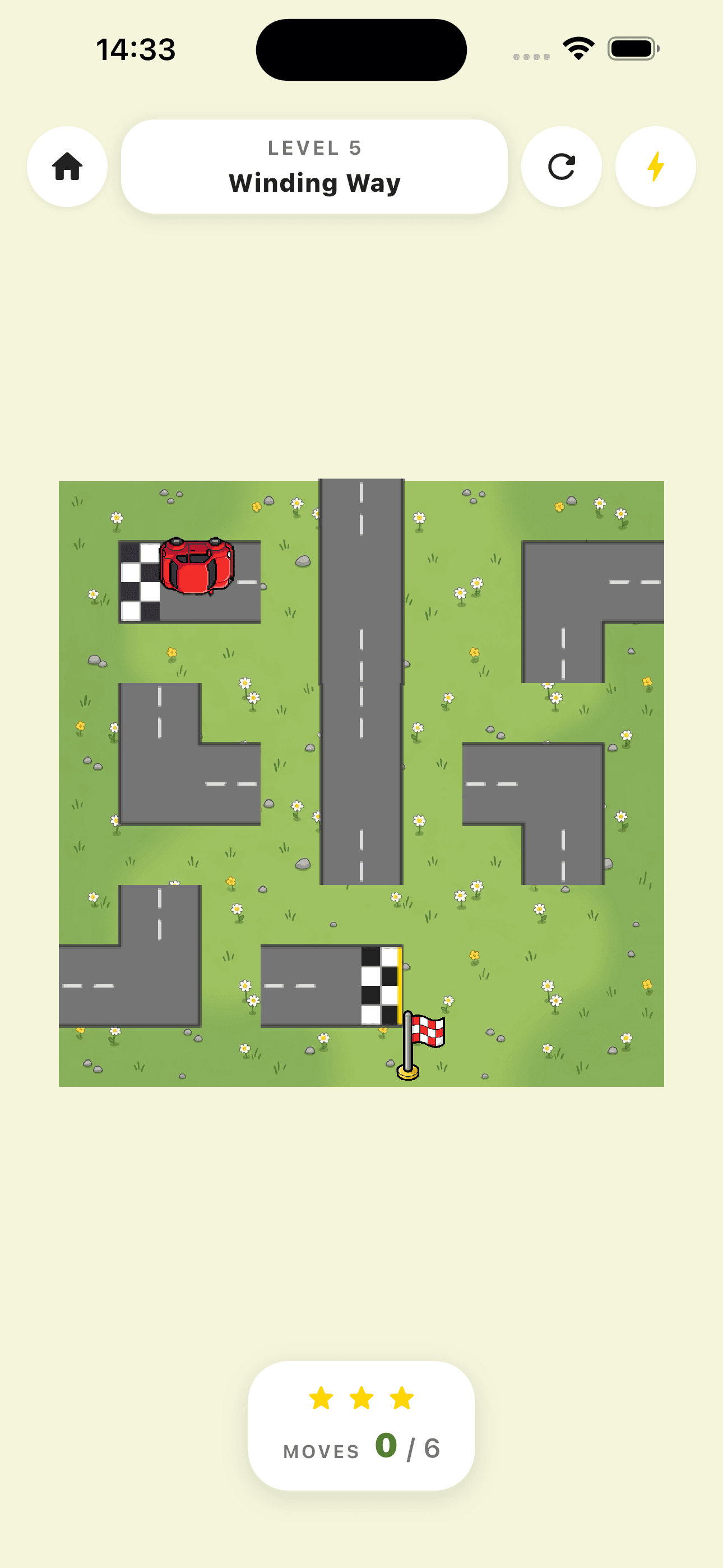 Roadie gameplay showing a road tile puzzle with a red car and finish flag